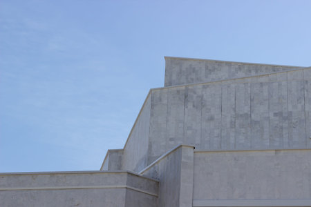 The building is against the blue sky. Urban architecture. Minimalism