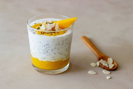 Yogurt in a glass with mango, chia and almonds. Healthy eating. Vegetarian food. Recipe. Breakfast. Dietの写真素材