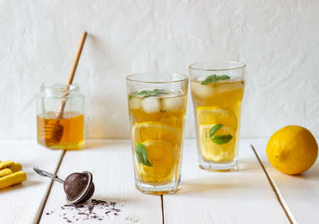 Cold tea with lemon and mint. A summer drink. Healthy eating. Vegetarian food. Dietの写真素材