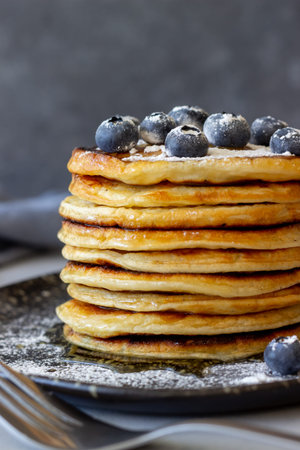 Pancakes with blueberries and honey. Breakfast. Vegetarian food. Recipe