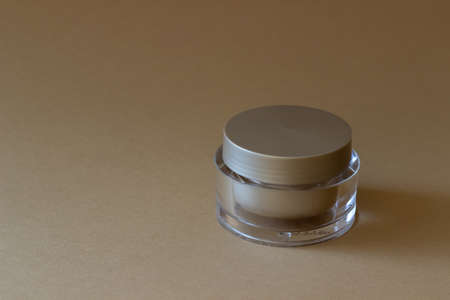 A jar of cream on a beige background. Cosmetics. Skincare. Mock-up. Copy spaceの写真素材