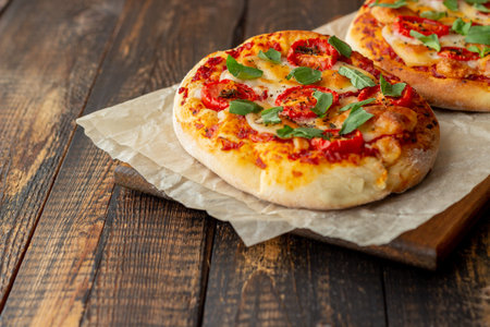 Italian focaccia or pizza with mozzarella, tomatoes and basil. Healthy eating. Vegetable food