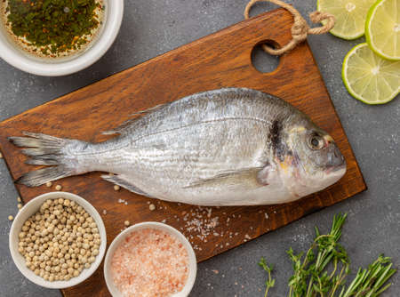 Raw dorado fish with lime, pepper and salt. Healthy eating. Sea food. Dietの写真素材