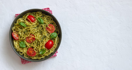 Pasta spaghetti with pesto sauce, tomatoes and basil. Healthy eating. Vegetable foodの写真素材