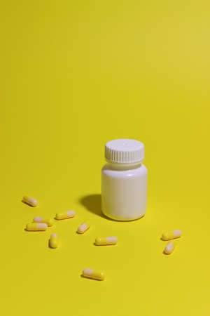 Pills on a yellow background. Medicine. Health Medicationの写真素材