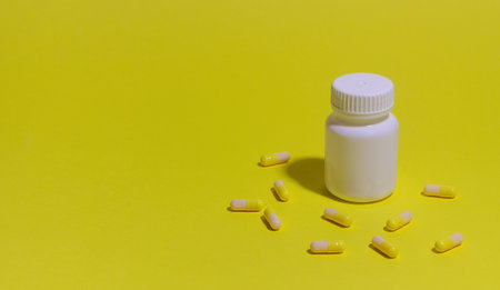 Pills on a yellow background. Medicine. Health Medicationの写真素材