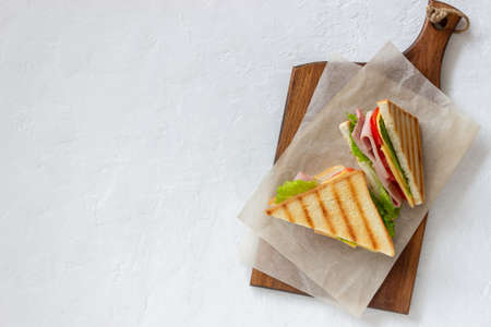 Sandwich with ham, salad, tomatoes and cheese. American cuisine. Fast foodの写真素材