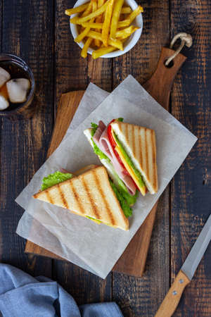 Sandwich with ham, salad, tomatoes and cheese. American cuisine. Fast foodの写真素材