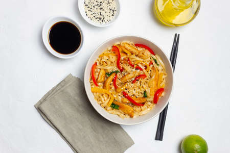 Udon noodles with chicken, pepper and sesame. Chinese foodの写真素材