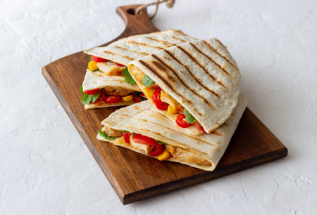 Quesadilla with chicken, tomatoes, corn, cheese and chilli. Mexican food Fast food