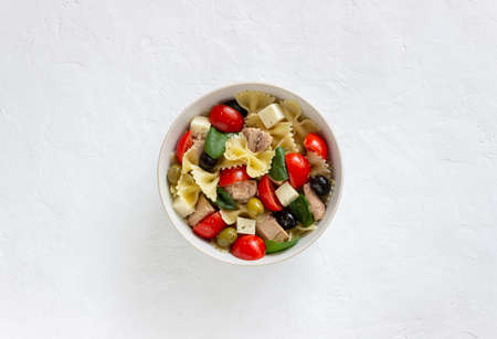 Pasta salad with tuna, tomatoes and white cheese. Farfalle. Healthy eating. Dietの写真素材