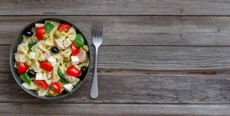 Pasta salad with tuna, tomatoes and white cheese. Farfalle. Healthy eating. Dietの写真素材