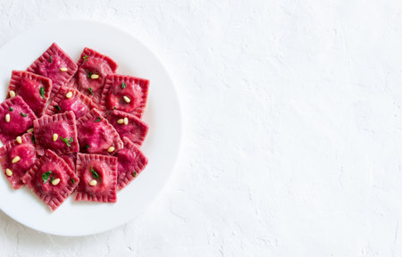 Beet ravioli with ricotta cheese, spinach and nuts. Healthy eating. Vegetarian food. Italian cuisineの写真素材