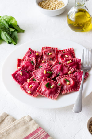 Beet ravioli with ricotta cheese, spinach and nuts. Healthy eating. Vegetarian food. Italian cuisineの写真素材