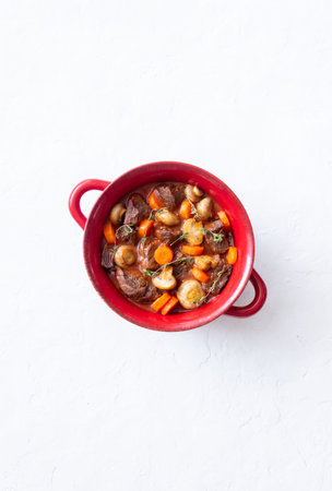 Burgundy beef stewed with potatoes, carrots and champignons French cuisine