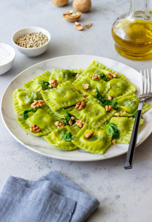 Green ravioli with ricotta cheese, spinach and nuts. Healthy eating. Vegetarian food. Italian cuisineの写真素材