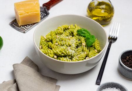 Fusilli pasta with pesto sauce, cheese and nuts. healthy eating. Vegetarian food. Italian foodの写真素材