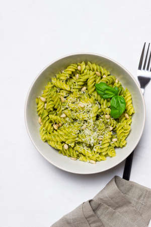Fusilli pasta with pesto sauce, cheese and nuts. healthy eating. Vegetarian food. Italian foodの写真素材