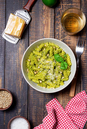 Fusilli pasta with pesto sauce, cheese and nuts. healthy eating. Vegetarian food. Italian foodの写真素材