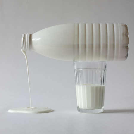 Bottle and glass of yogurt on a white background. healthy eating. Dietの写真素材