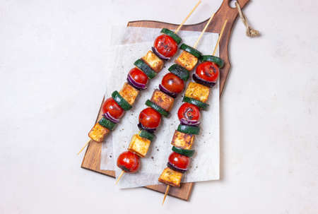 Grilled skewers with halloumi cheese, zucchini, tomatoes and onions. Kebab. healthy eating. Vegetarian foodの写真素材