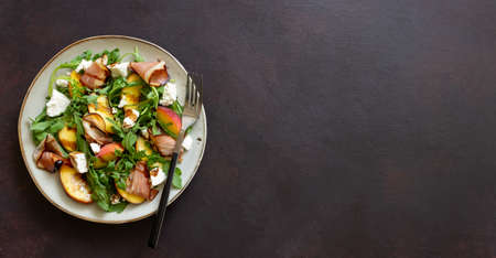 Salad with peaches, arugula, cheese and jamon. Healthy eatingの写真素材