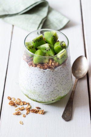 Chia pudding with kiwi and granola. healthy eating. Vegetarian food.の写真素材