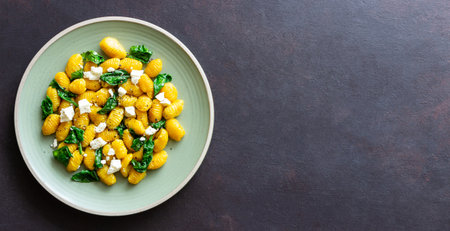 Pumpkin gnocchi with spinach and white cheese. healthy eating. Vegetarian food. Diet.の写真素材