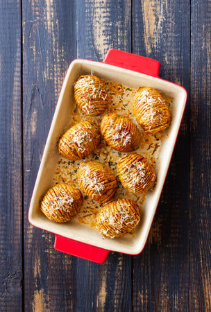Baked Hasselback potatoes. american food. Vegetarian food
