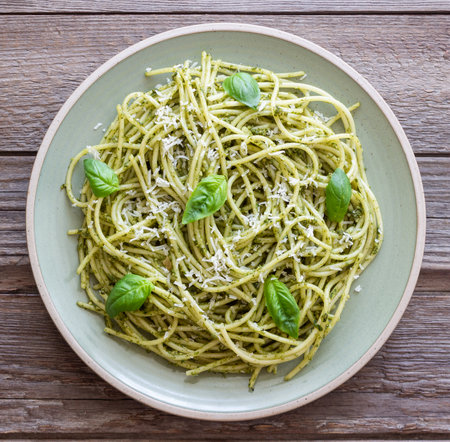 Spaghetti pasta with pesto, basil and Parmesan cheese. Italian food. Vegetarian foodの写真素材