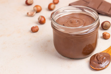 Chocolate paste with nuts in a jar. Dessert. Vegetarian foodの写真素材
