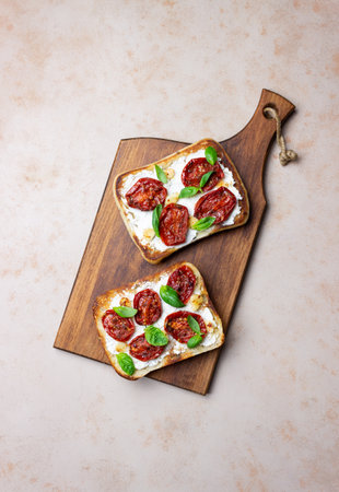 Ciabatta with sun-dried tomatoes, white cheese and basil. Italian food. Vegetarian foodの写真素材