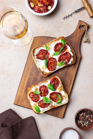 Ciabatta with sun-dried tomatoes, white cheese and basil. Italian food. Vegetarian foodの写真素材