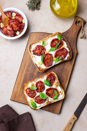 Ciabatta with sun-dried tomatoes, white cheese and basil. Italian food. Vegetarian foodの写真素材