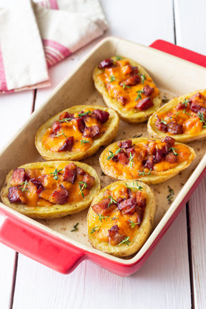 Baked potatoes with bacon, cheese and thyme. Homemade foodの写真素材