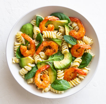 Pasta salad with shrimps, avocado and spinach. Healthy eating. Seafood.の写真素材