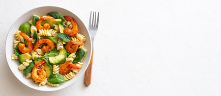 Pasta salad with shrimps, avocado and spinach. Healthy eating. Seafood.の写真素材