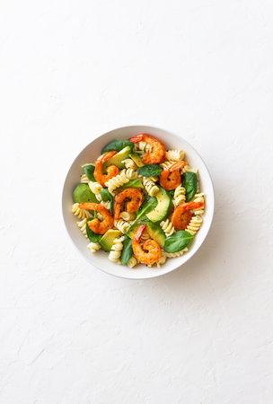 Pasta salad with shrimps, avocado and spinach. Healthy eating. Seafood.の写真素材
