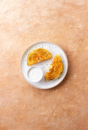 Cabbage steaks with white sauce. Healthy eating. Vegetarian food
