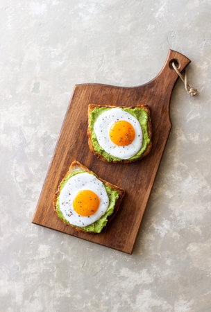Toast with guacamole and eggs. Healthy eating. Breakfastの写真素材