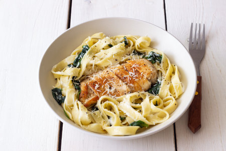 Pasta alfredo with chicken, spinach and cheese. Italian foodの写真素材