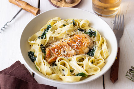 Pasta alfredo with chicken, spinach and cheese. Italian foodの写真素材