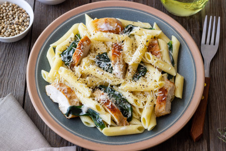 Pasta alfredo with chicken, spinach and cheese. Italian foodの写真素材
