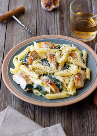 Pasta alfredo with chicken, spinach and cheese. Italian foodの写真素材