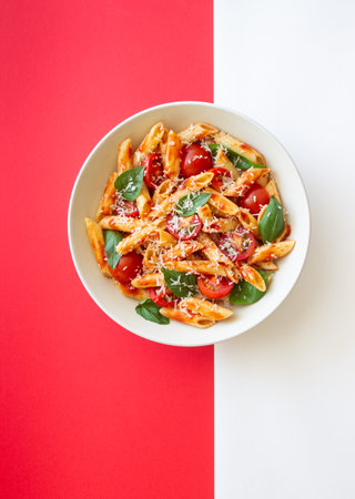 Pasta penne alla arrabiata with tomatoes, basil and parmesan cheese. Healthy Eating. Vegetarian Foodの写真素材