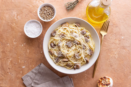 Spaghetti pasta in creamy sauce with mushrooms and cheese. Vegetarian food. Italian cuisine.の写真素材