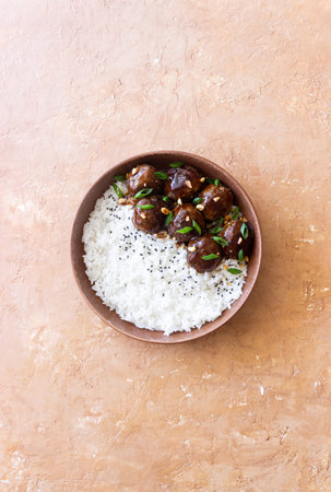 Beef meatballs in teriyaki sauce with rice. Asian food