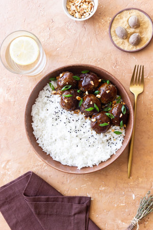 Beef meatballs in teriyaki sauce with rice. Asian food