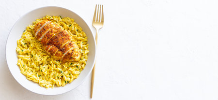 Orzo pasta with roasted chicken breast and curry sauce. Recipe. Healthy eatingの写真素材