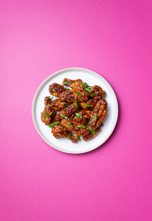Chicken wings in teriyaki sauce with sesame and onion. Asian foodの写真素材